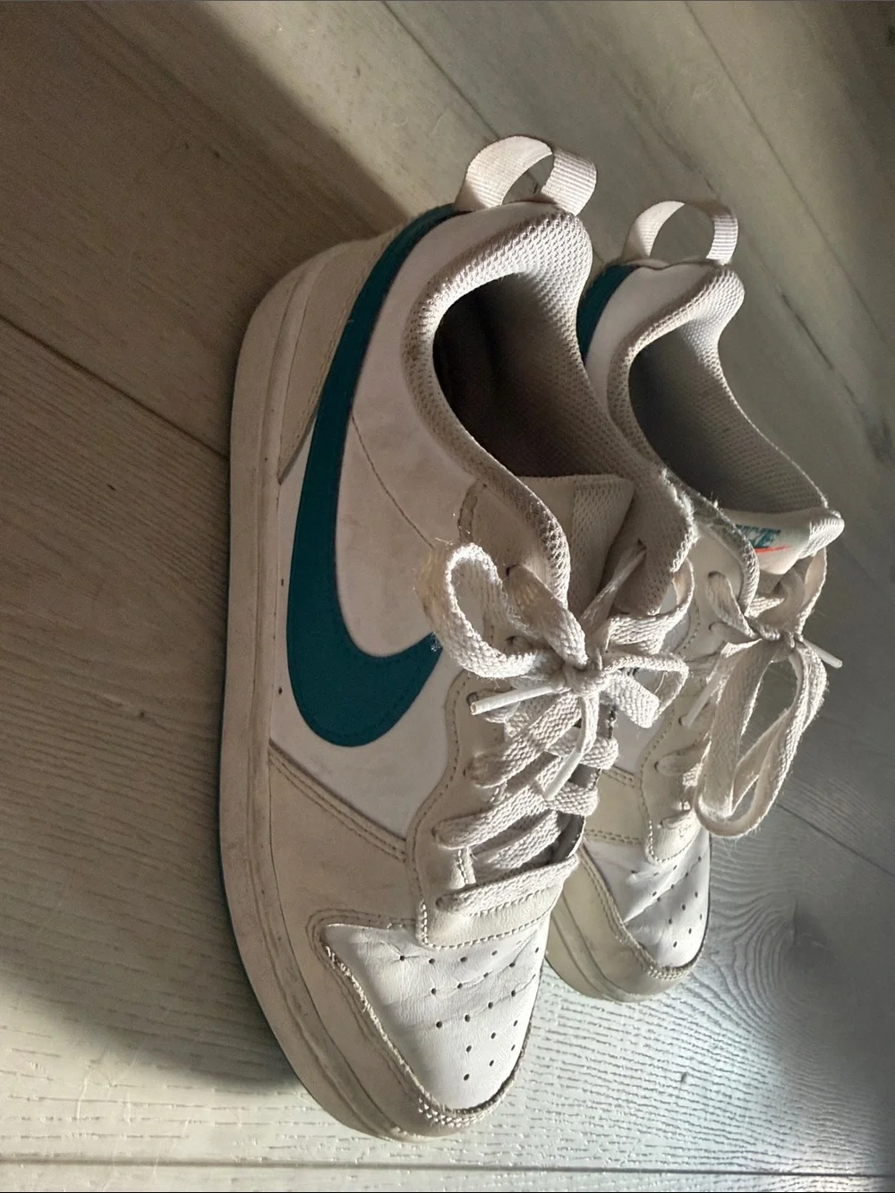 Nike Kids White Sneakers with Teal Swoosh Accent